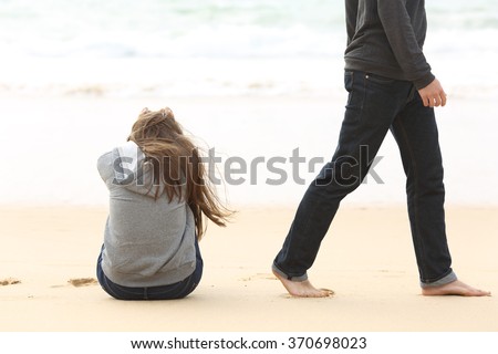 Teenager couple breaking up and ending relation after argument. Boyfriend legs leaves his sad girlfriend and go away