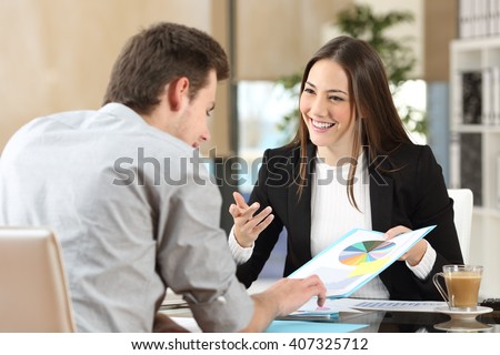 Businesspeople smiling coworking commenting and showing growth graphic and taking a business conversation in an office interior