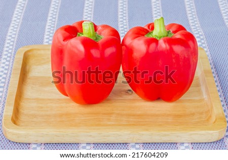 Twin Red Pepper , Sweet red pepper on Wood Tray and tablecloth, Bright Fresh red Sweet pepper