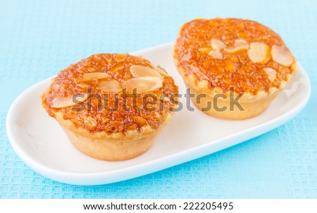 Almond Cake, Almond with Banana Cake, Fresh Almond Bakery Cake, Banana Cake Topped with Almonds or Almond banana bread on white plate, Sweet and Snack for tea time