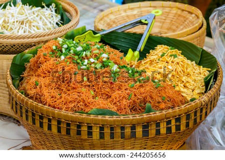 Stri Fried Rice vermicelli served with bean sprouts and slices fried egg, Korat's stir fried Bean Thread noodle, stri fried thin rice stick noodles in traditional thai food