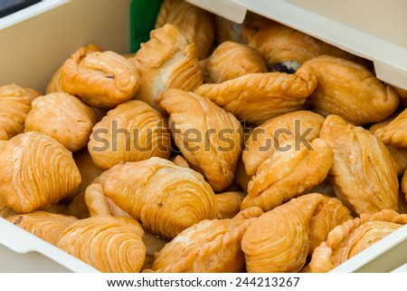 Vegetarian samosa or curry puff, Golden Brown curry puff in a box tray ready for sale