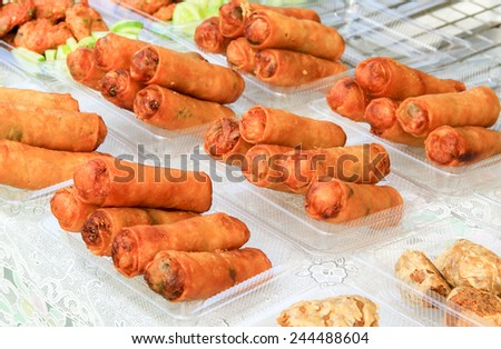 Spring Rolls in plastic box, Golden Brown Spring Roll on Plastic box, Thai Local street Food, deep fried spring roll or Fresh Vegetable Spring