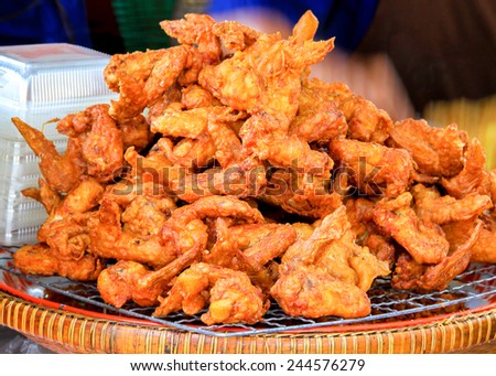Chicken wings, Deep Fried Chicken wings on grill tray Thai Street Food, Golden Brown Fry Chicken wing