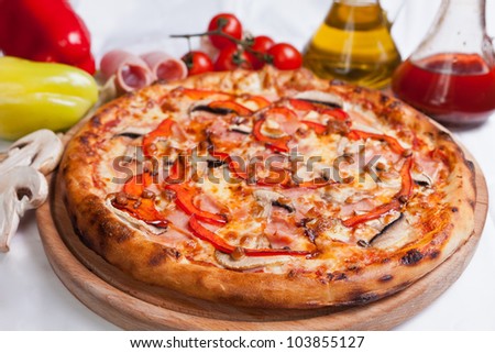 Pizza with mozzarella, ham and mushrooms