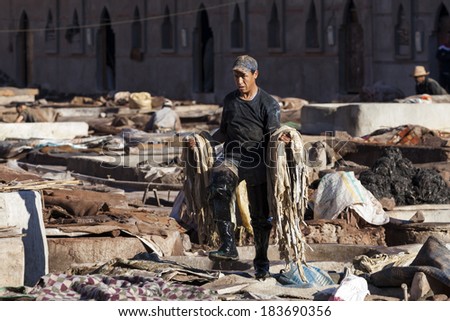 MARRAKECH, MOROCCO - MARCH 6: Workers at leather factory perform the work on March 6, 2014. Tanning production is one of the most ancient in Morocco