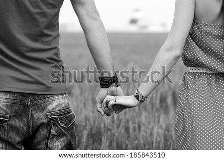 Holding hands couple black and white