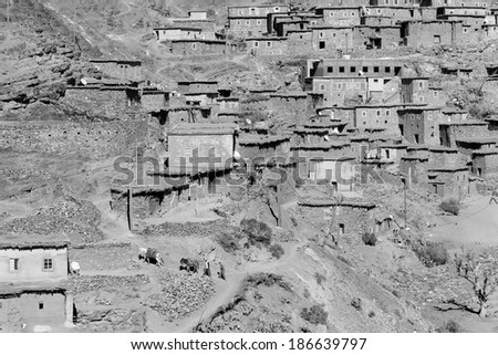 ATLAS MOUNTAINS, MOROCCO - FEBRUARY 28: Village in Atlas Mountains on February 28, 2014. Atlas is a mountain range across the northwestern stretch of Africa extending about 2,500 km in Morocco.