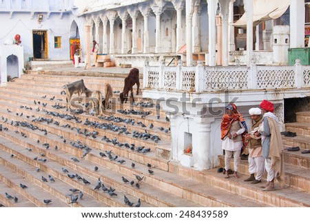 PUSHKAR, INDIA - JAN 08: Indian men on street of Pushkar on January 08, 2015. Agra is a town in the Ajmer district in the Indian state of Rajasthan.