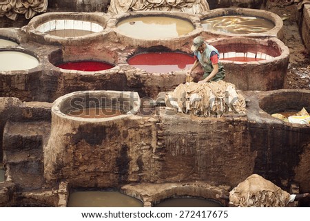 FEZ, MOROCCO - APRIL 15: Workers at leather factory perform the work on April 15, 2015. Tanning production is one of the most ancient in Morocco