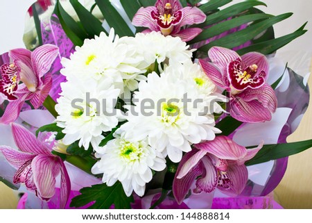 Bouquet of orchids and chrysanthemums isolated on white background