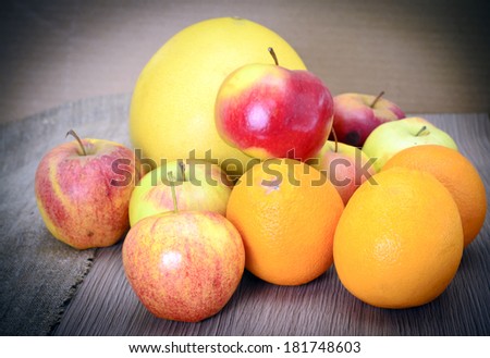 Apple, Orange, Grapefruit on Bowl Isolated on White Background