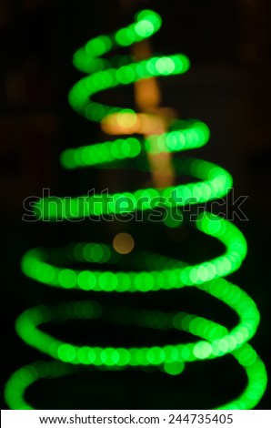 christmas tree colored circles on a dark background bokeh
