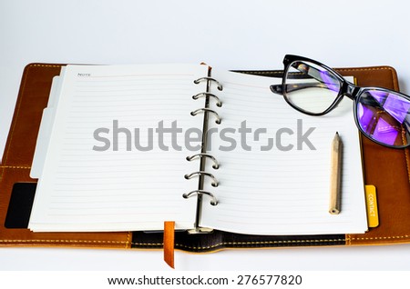 Blank Diary , Pencil and glasse  on the white background