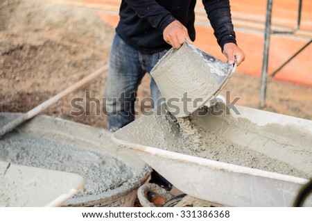 soft focus or Selective focus  construction workers pouring cement