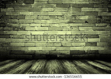 Empty old spacious room with stone grungy wall weathered dirty floor, vintage background texture of brickwall