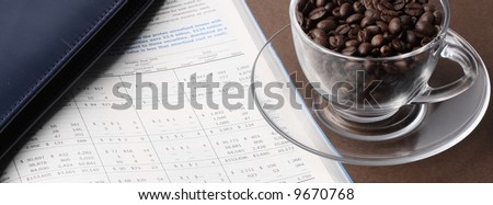 Wide Business still life with report, cardholder, cup of coffee beans and pills