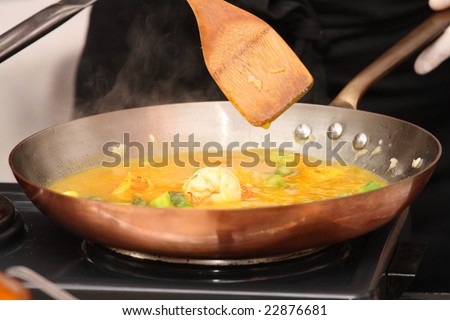 restaurant chief preparing sauce