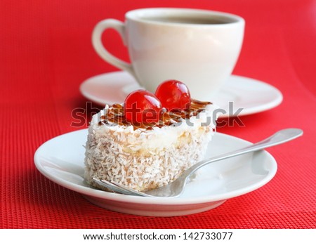 Cakes with biscuit, butter cream and coconut