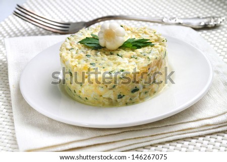 Salad with krill meat, canned pineapple, eggs, cheese, parsley and mayonnaise