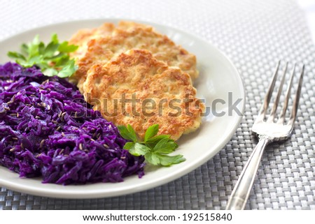 Chicken fritters and stewed red cabbage with caraway seeds
