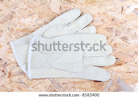 Working gloves on the wooden background