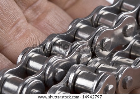 Hand with metal link chain