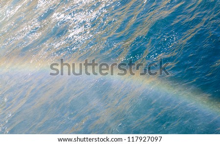 Rainbow above the surface of Mediterranean sea in the spray of a waterfall Lower Duden -?? Antalya, Turkey
