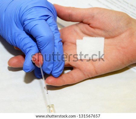ROSTOV-ON-DON, RUSSIA - March 2:  An unknown donor\'s blood is tested before donation. The City Blood Service makes a promo action for donorship popularization, March 2, 2013 in Rostov-on-Don, Russia.