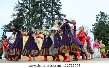 ROSTOV-ON-DON, RUSSIA - MARCH 17: Cossack dancing and singing. The Cossack Maslenitsa - traditional celebration and national ski races around, March 17, 2013 in Rostov-on-Don, Russia