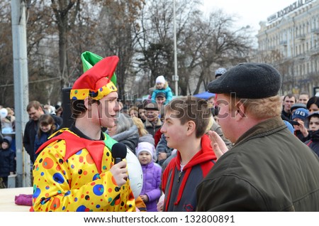 ROSTOV-ON-DON, RUSSIA - 17 March: Jester entertains the audience at the square. The Cossack Maslenitsa - traditional celebration and national ski races around, March 17, 2013 in Rostov-on-Don, Russia