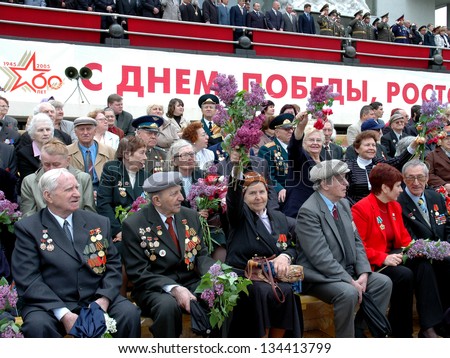 ROSTOV-ON-DON, RUSSIA - MAY 9: Veterans of the WWII sit on the podium during the celebration of the 60th anniversary of Victory Day (WWII) on Theater Square, May 9, 2005 in Rostov-on-Don, Russia