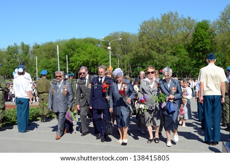 ROSTOV-ON-DON, RUSSIA - MAY 7: The rally, placing flowers International automobile race \