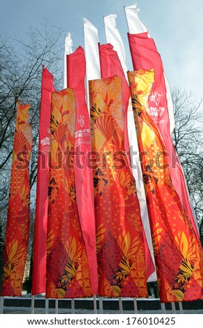 ROSTOV-ON-DON, RUSSIA - JANUARY 26: Olympic flags fluttering in the wind. On the eve of the 2014 Winter Olympics in flags are set with Olympic symbols, January 26, 2014 in Rostov-on-Don, Russia