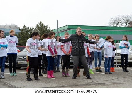 ROSTOV-ON-DON, RUSSIA - FEBRUARY 13: Flash-mob - 100m in uggah in support of the Olympic Games 2014. Instructing and workout at the start. Rostov-on-Don, February 13, 2014 in Rostov-on-Don, Russia