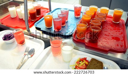 Factory canteens - yogurt, juice, juice, salad, bread on trays