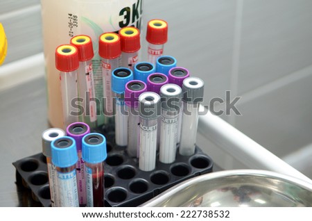 Tubes of blood for medical analysis and empty tubes in a laboratory