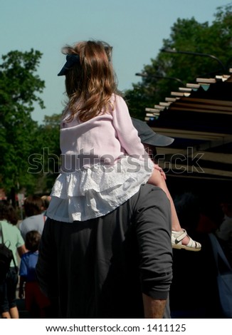 Father with daughter riding piggyback