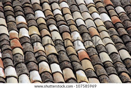 Mediterranean old roof tiles on the roof of an old house