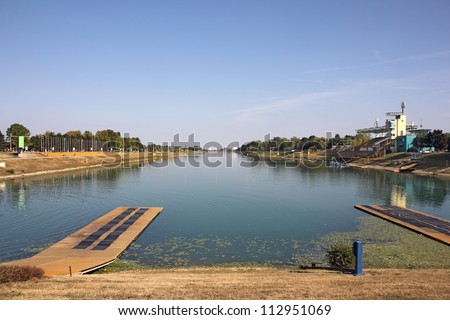 Rowing track with eight lanes for racing boats and bleachers for spectators