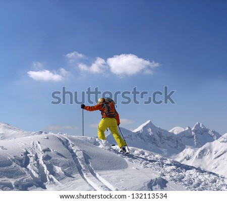 Extreme skier climbs to the top of the mountain
