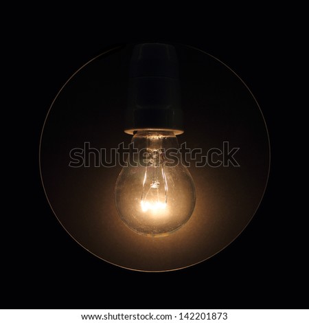 Glass light bulb glows in the dark