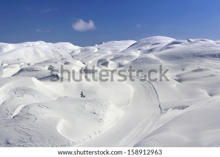 Great snow dunes and clouds in the background in Vogel, Slovenia
