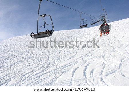 Ski lift and skiers on the Mountain ski resort Gerlitzen, Austria