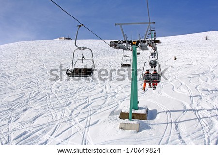 Ski lift and skiers on the Mountain ski resort Gerlitzen, Austria