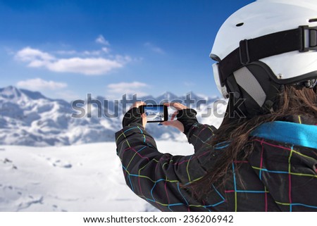 Photographing winter landscape mountains and snow, with cell phone