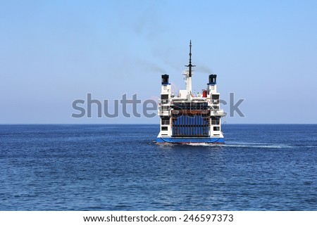 Big white ferry laden cars floating seaward