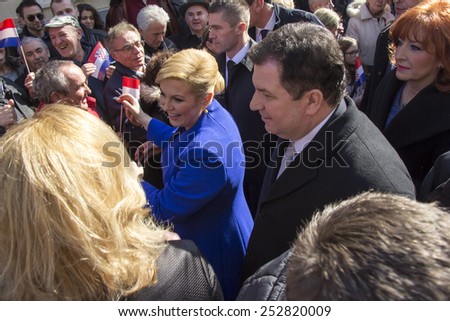 ZAGREB, CROATIA - FEBRUARY 15: Kolinda Grabar Kitarovic the first woman President of Croatia, through the crowd, is coming to the inauguration at St. Mark\'s Square, on February 15, 2015 in Zagreb.