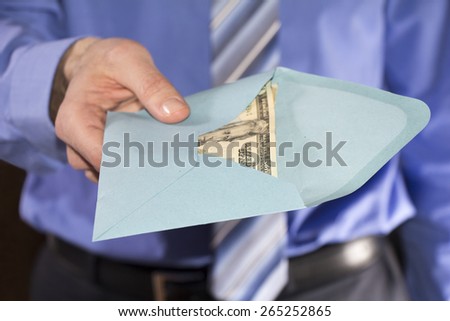 Man in a blue shirt, giving bribe in a blue envelope