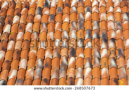 Traditional old roof tiles on Mediterranean houses, as texture background